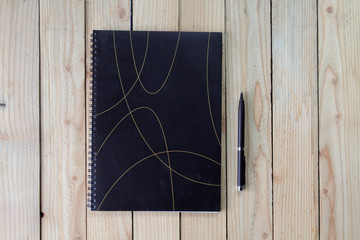 notebook on wood background