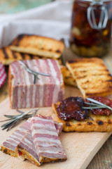 Meat bread with sun-dried tomatoes and croutons. selective focus