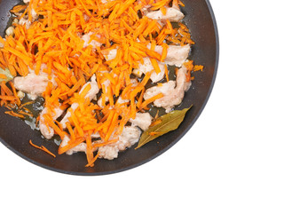 Roast meat with carrots in the pan, background