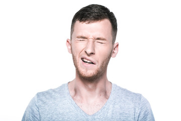 Obraz premium Tired sleepy young man yawning