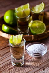 gold tequila with salt and lime