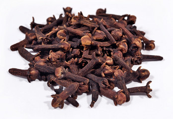 Heap of dried clove on a white