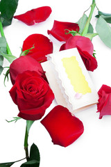 Red roses with a blank gift card