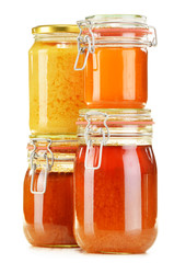 Composition with jar of honey isolated on white