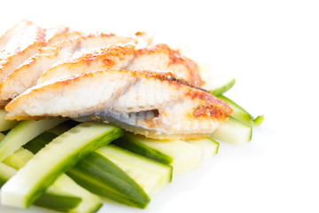 Sliced eel and cucumber isolated on white background