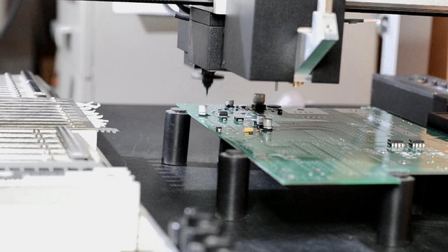 Install components on PCB robotic arm