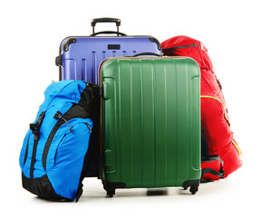 Suitcases and rucksack isolated on white