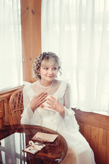 Beautiful woman in white dress received letters