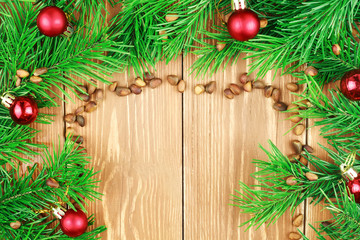 Fir branches with pine nuts and christmas toys. Copyspace