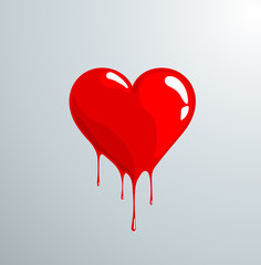 Red melting heart with reflection and drops.