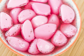 Shiso Pickled Garlic - Garlic cloves pickled with ume vinegar.