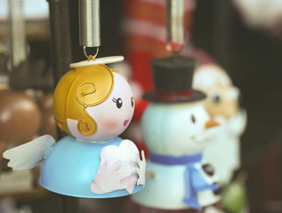 An Angel Christmas Ornament with Frosty and Santa