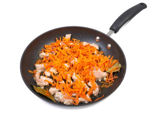 Roast meat with carrots in the pan isolated on white background