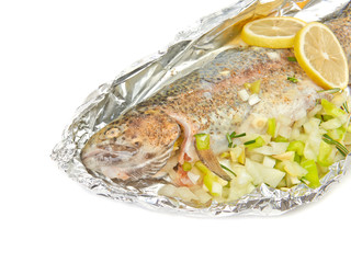 Fish fried trout in foil with lemon isolated on white background
