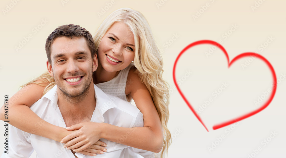 Wall mural happy couple having fun over beige background