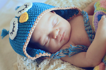 newborn in owl hat