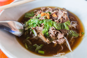 Thai Noodle small line with meat and vegetable.