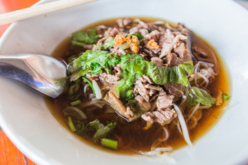 Thai Noodle small line with meat and vegetable.