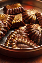 chocolate sweets with edible golden powdeer