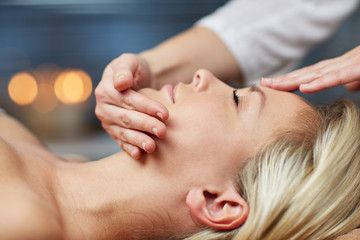 Fototapeta na wymiar close up of woman having face massage in spa