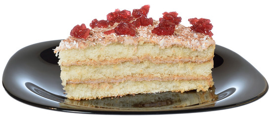 Layered piece of cake close up on a black plate