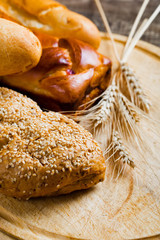 assortment of baked bread on wood table