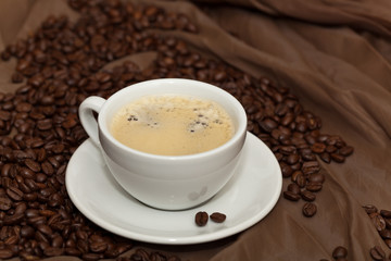 Coffee cup and beans. Selective focus.