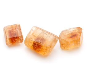 Brown caramelized lump cane sugar cube isolated on white backgro