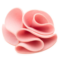cooked boiled ham sausage or rolled bologna slices isolated on w