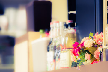Bouquet of flowers on the counter in coffee shop.