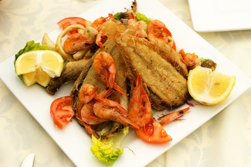 Tasty fish with seafood.