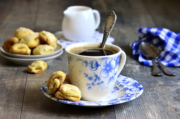 Cottage cheese biscuits with cup of coffee.
