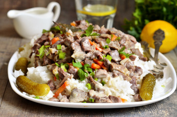Beef Stroganoff with rice garnish.