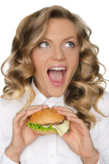 young woman with hamburger looking away