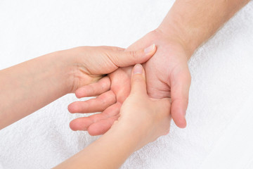 Physiotherapist Massaging Palm © Andrey Popov