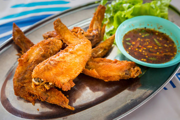 chicken wings with spicy sauce,Thai style.