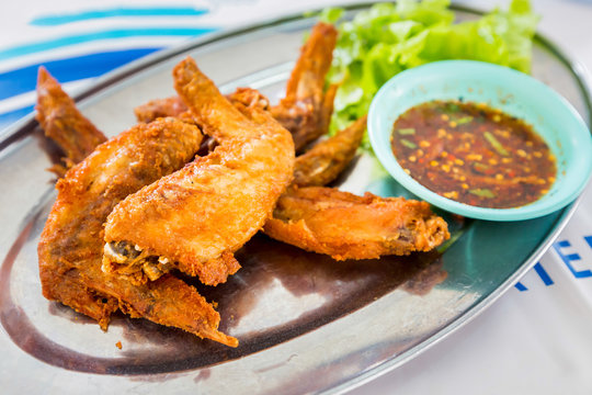 chicken wings with spicy sauce,Thai style.