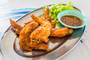 chicken wings with spicy sauce,Thai style.