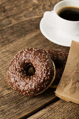 Overhead view of two tempting fresh doughnuts with their brown p