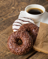Overhead view of two tempting fresh doughnuts with their brown p