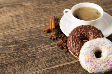 coffee and donut on wood background