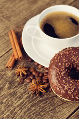 coffee and donut on wood background