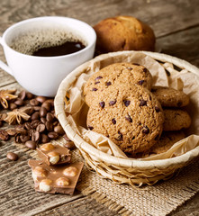coffee and cookies on wood background