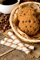 coffee and cookies on wood background