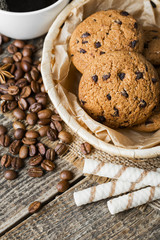 coffee and cookies on wood background