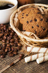 cookies and coffee on wood background