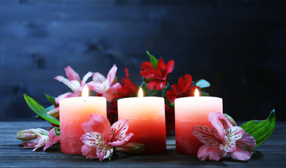 Obraz na płótnie Canvas Beautiful candles with flowers