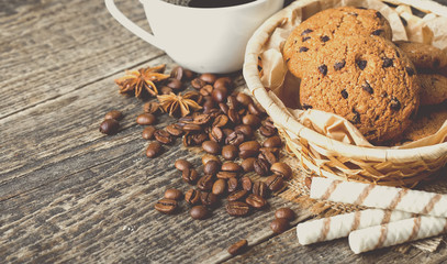coffee and cookies on wood background