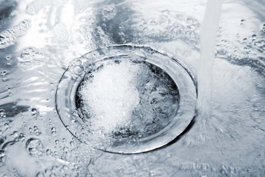 Water Flowing Down Hole In Kitchen Sink