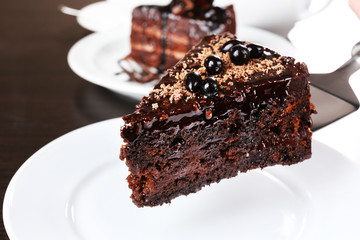 Yummy chocolate cake served on table, close-up